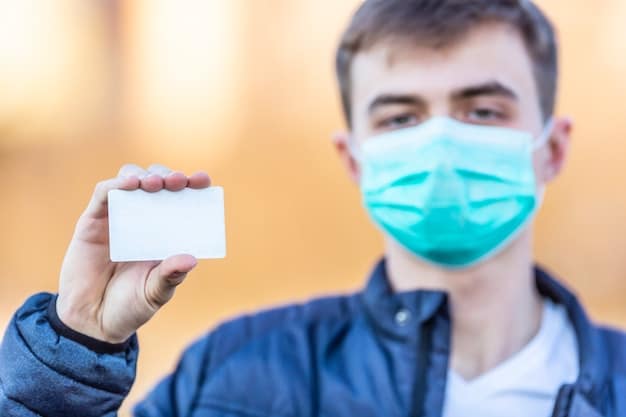 A close-up shot of a person's hand holding a health insurance card, with a blurred background of a doctor's office, symbolizing the security and access that healthcare reform aims to provide.